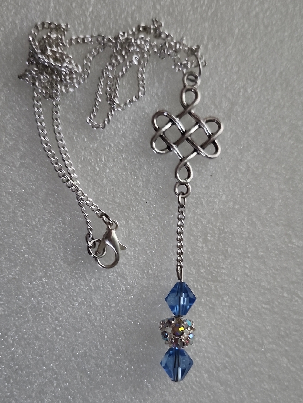 Hand Crafted Silver Knot Necklace with Blue Beads